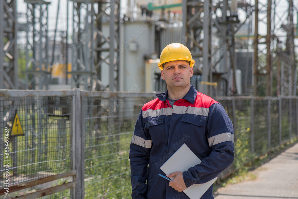 The energy engineer inspects the equipment of the substation. Power engineering. Industry. The energy engineer inspects the equipment of the substation. Power engineering. Industry.