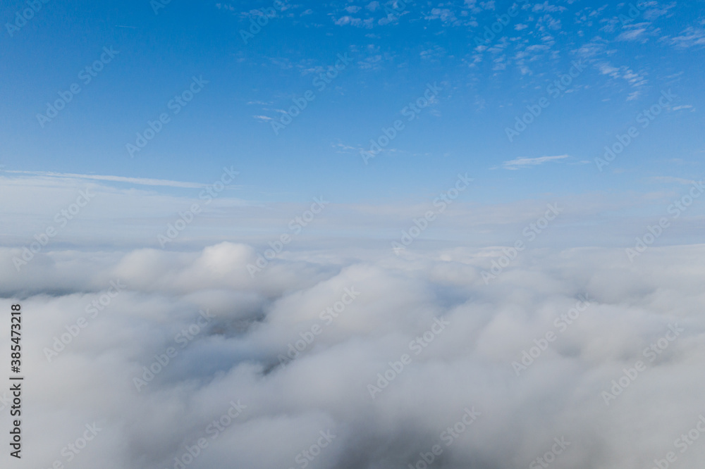 Aerial view over the sky clouds in day time with solar halo on the clouds Aerial view over the sky clouds in day time with solar halo on the clouds