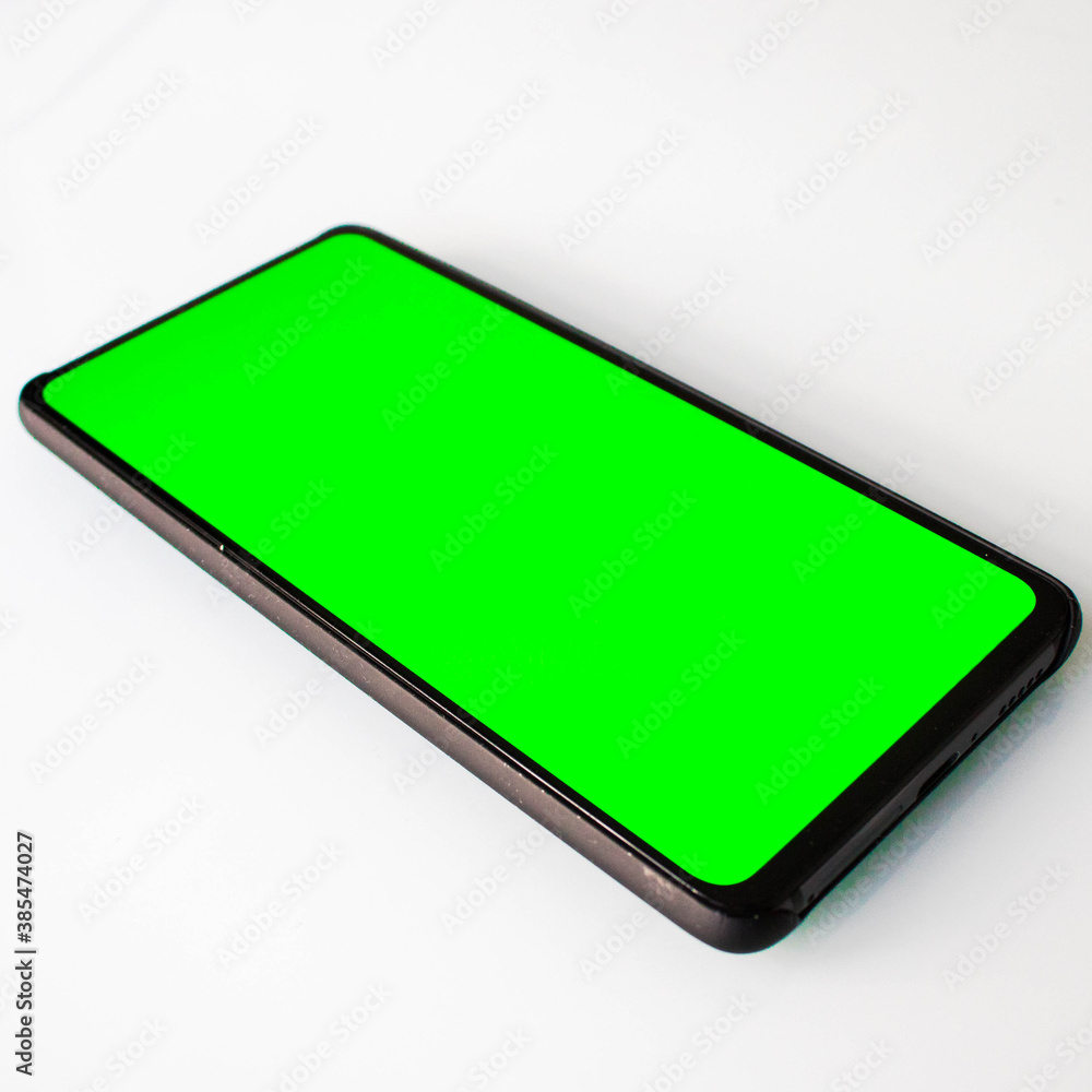 Smartphone with green screen, green screen phone on white, telephone on white, phone with green screen Smartphone with green screen, green screen phone on white, telephone on white, phone with green screen