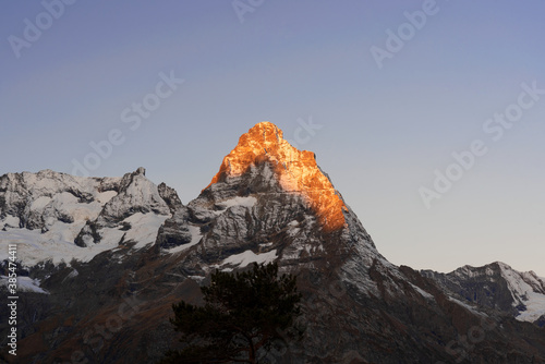 top of Mount Belalakaya in Dombai at sunrise with blue sky.