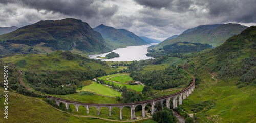 Aerial view of Glenfinnan viaduct with loch Shiel and montains in the background