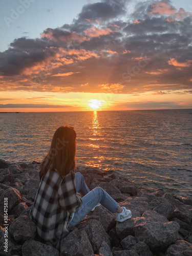 person on the beach at sunset