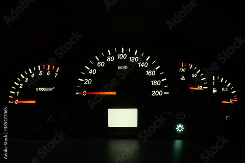 Analog car dashboard with white backlight.