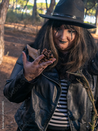 Woman posing in disguise for Halloween in a forest