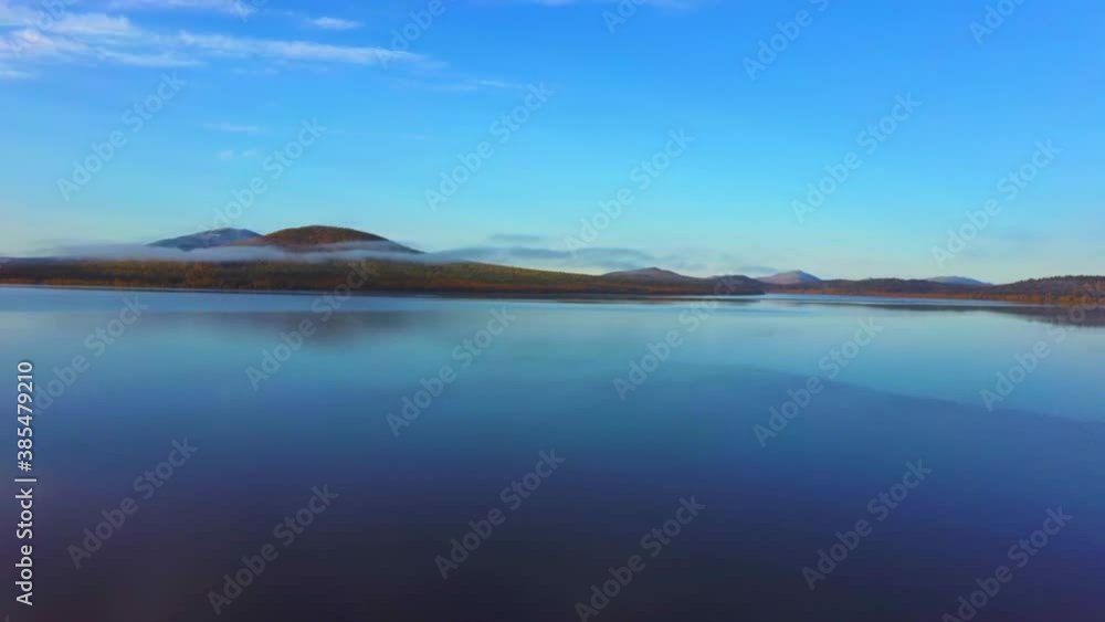 Aerial video of beautiful mountain lake on a frosty autumn morning. Aerial video of beautiful mountain lake on a frosty autumn morning.
