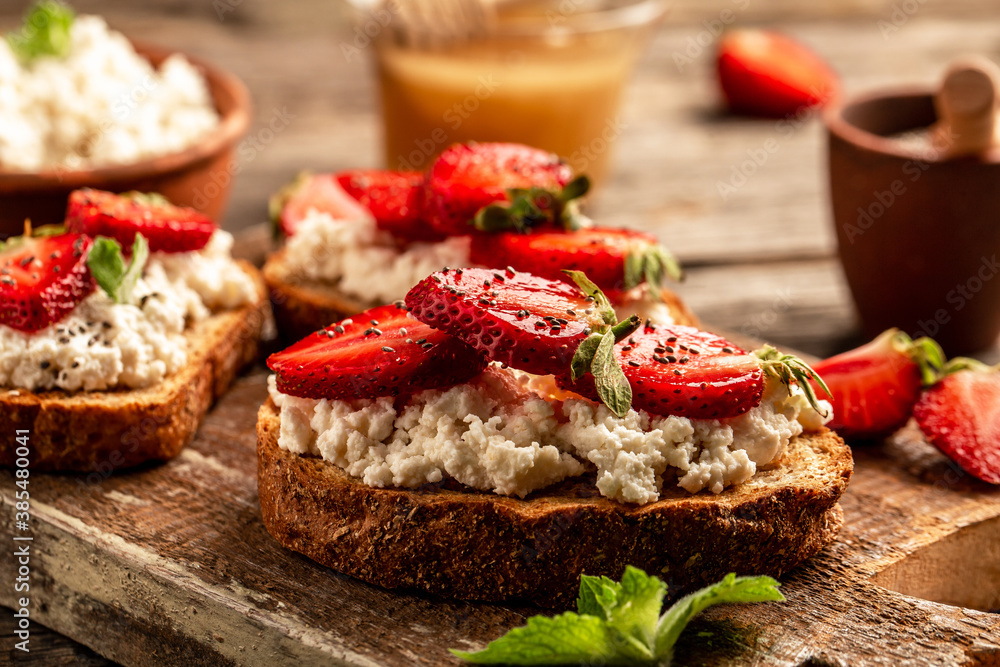 Healthy breakfast toasts with cheese ricotta blueberries, strawberries, raspberries Healthy breakfast toasts with cheese ricotta blueberries, strawberries, raspberries