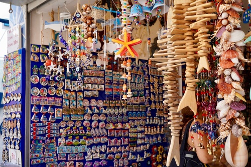 Bodrum, Turkey - August, 2020: Atmospheric local souvenir markets. Turkish Grand Bazaar. Hand-made souvenirs at street market. Souvenirs: wind music, dream catcher, evil eye keychain, beads, bracelets