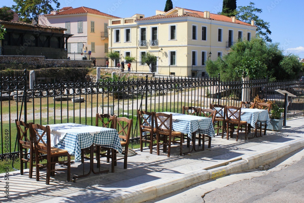 Greece, Athens, October 9 2020 - Empty chairs and tables of a traditional restaurant in the touristic district of Plaka.