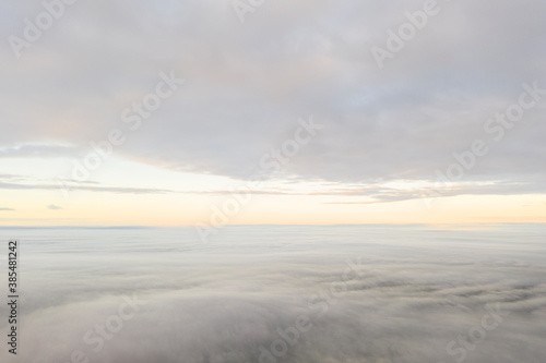 Aerial view white clouds. View from drone. Aerial top view cloudscape texture. Texture of clouds. View from above. Panorama clouds background © Aleksei