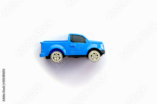 Children’s toy little blue car on a white background. Copy space for text