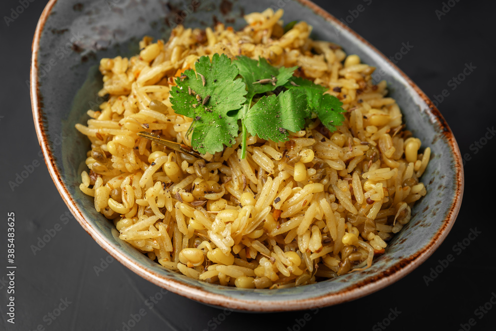 Kichari decorated with parsley leaves close-up Kichari decorated with parsley leaves close-up