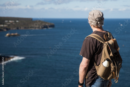 Active senior man penioner outdoors exploring travel 