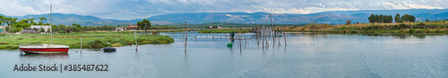 View of Lake Lesina with the structures of a fish farm in the foreground. Apulia - Italy photo