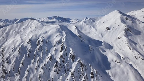 Aerial view of ski slopes in Horberg area, Mayrhofen ski, Tyrol, Austria. Speeded up from 24 fps. 2.5x speeded up from 24 fps. photo