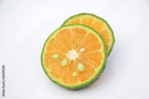 sliced orange fruit isolated on white background.