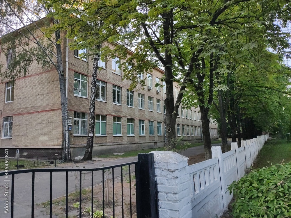 the territory of the old brick school with a yard the territory of the old brick school with a yard