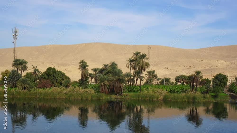Egypt Nile river side view felucca boat and telephone signal tower Egypt Nile river side view felucca boat and telephone signal tower