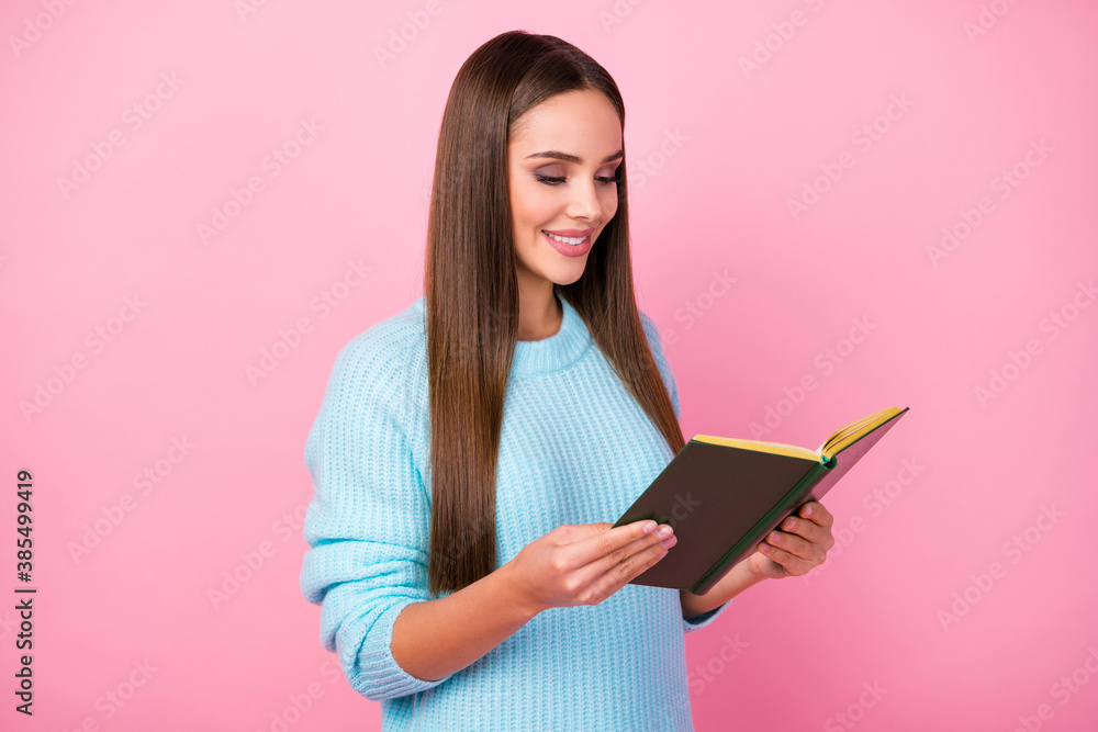 Profile photo of attractive lady hold book hands interesting reading spend free time with favorite novel hobby wear knitted blue pullover isolated pastel pink color background Profile photo of attractive lady hold book hands interesting reading spend free time with favorite novel hobby wear knitted blue pullover isolated pastel pink color background