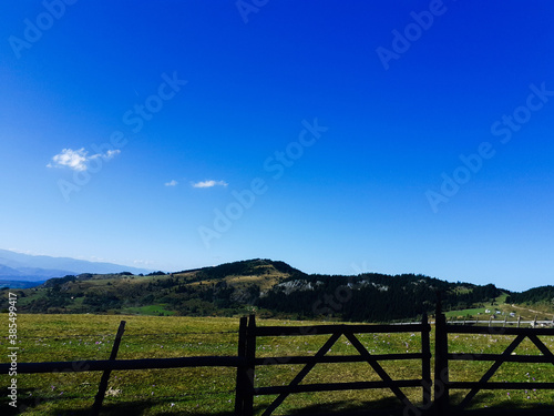 landscape with fence and blue sky