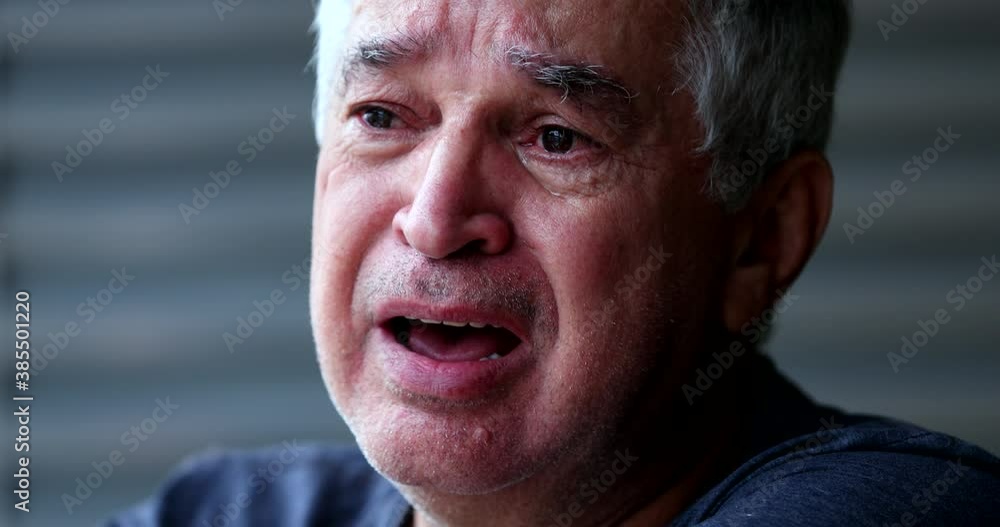 Emotional older man crying. Senior person sobbing in despair Emotional older man crying. Senior person sobbing in despair