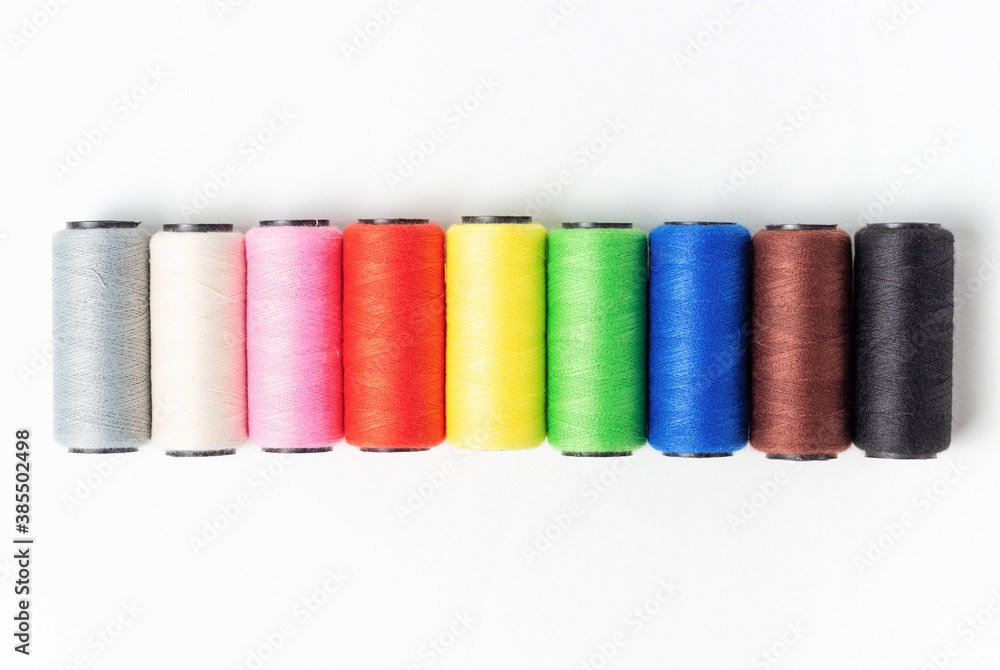 Threads of light dark colors on white background, top view Threads of light dark colors on white background, top view