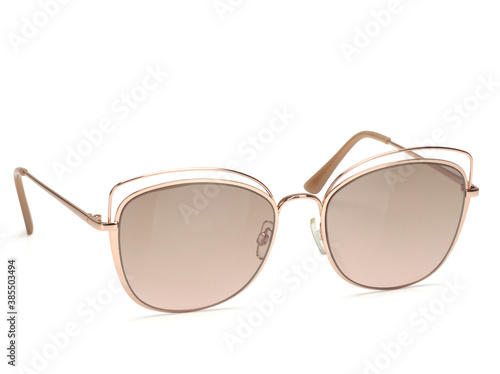 Sunglasses on white background close-up, top view