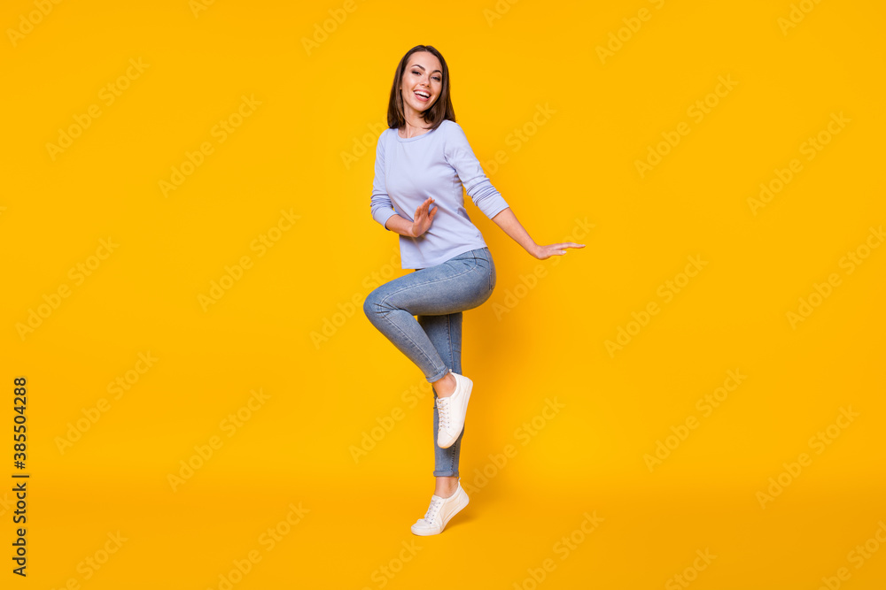 Full length body size view of her she nice attractive pretty girlish cheerful cheery girl jumping having fun dancing good mood spring isolated bright vivid shine vibrant yellow color background Full length body size view of her she nice attractive pretty girlish cheerful cheery girl jumping having fun dancing good mood spring isolated bright vivid shine vibrant yellow color background