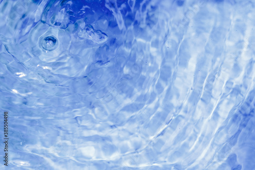 Water splash in blue abstract background