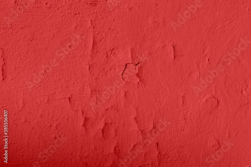 Red cracked paint texture. Background of old red surface with paint swell © Maksim
