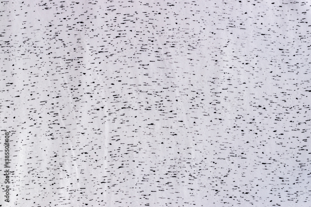 White jersey cotton fabric with black spots texture. Spotted textile background White jersey cotton fabric with black spots texture. Spotted textile background