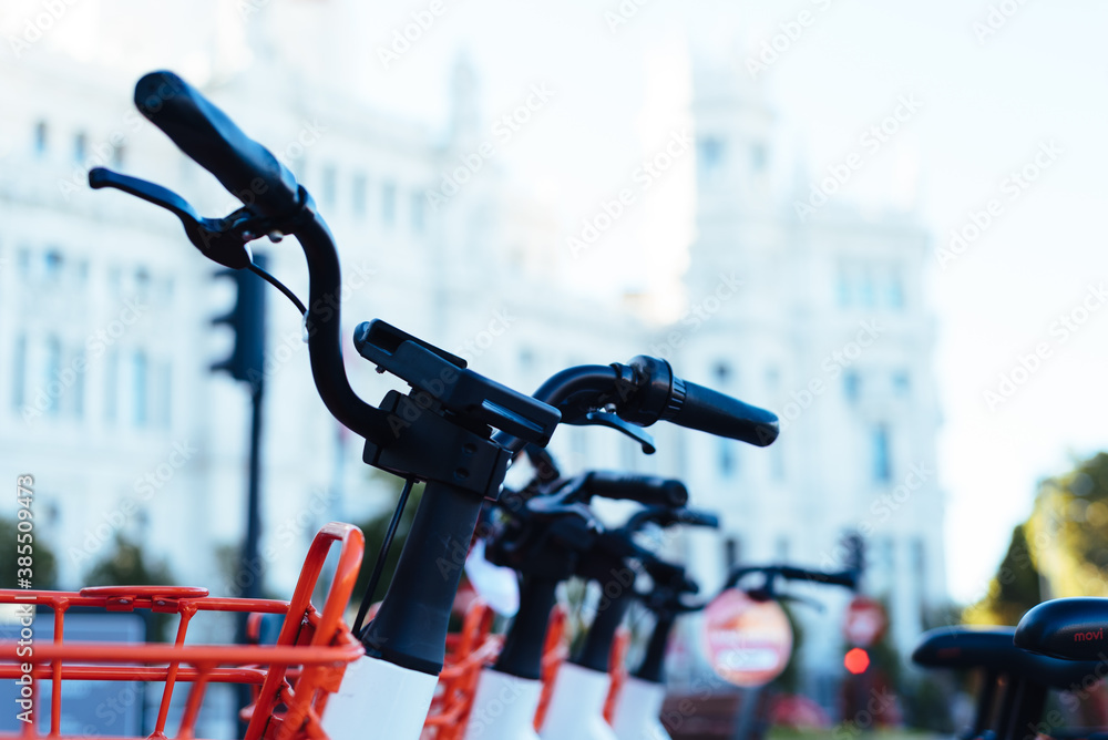 Electric bicycles for hire in central Madrid. Close up view of handlebars Electric bicycles for hire in central Madrid. Close up view of handlebars