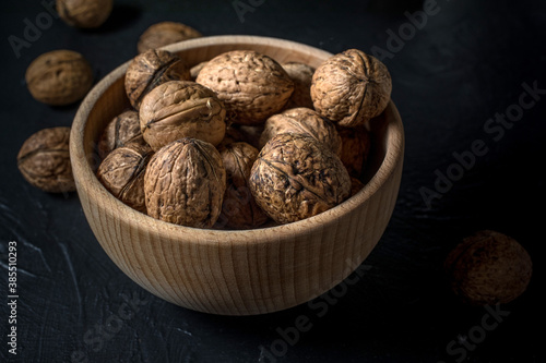 Walnuts in a wooden bow.