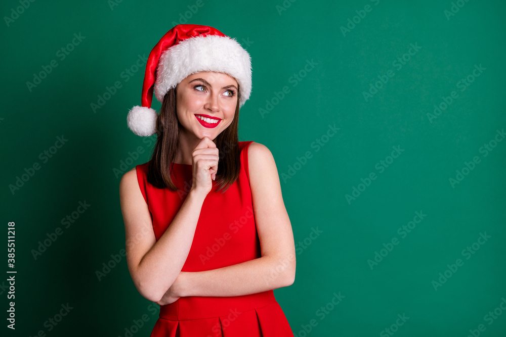 Photo of pretty attractive lady look dreamy empty space hand chin think of newyear party 2021 event boyfriend meeting wear santa cap red dress costume isolated green color background Photo of pretty attractive lady look dreamy empty space hand chin think of newyear party 2021 event boyfriend meeting wear santa cap red dress costume isolated green color background