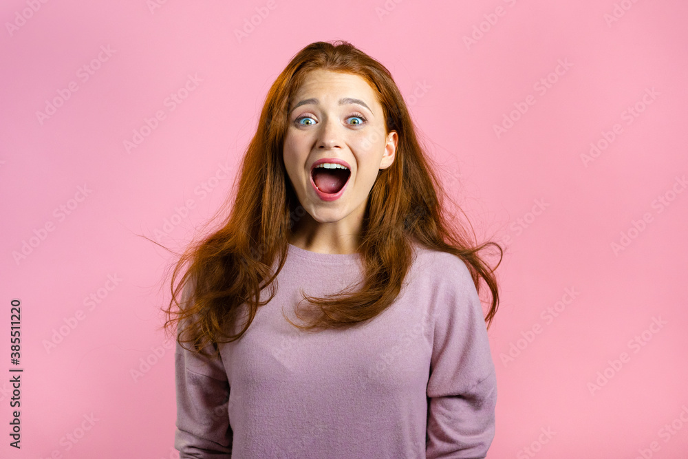 Woman with red hair very glad, she screaming loud. Woman trying to get attention. Concept of sales, profitable offer. Excited happy lady on pink studio background. Woman with red hair very glad, she screaming loud. Woman trying to get attention. Concept of sales, profitable offer. Excited happy lady on pink studio background.