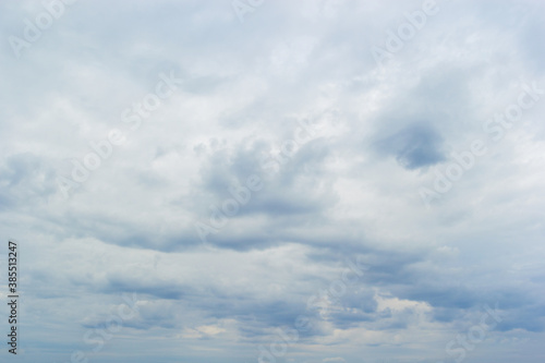 Blue fluffy clouds float in the sky. Natural outdoor photography.