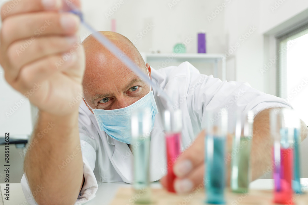 professional working with laboratory glassware professional working with laboratory glassware