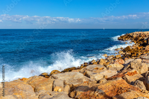 Panoramic view of stony Mediterranean coastline and beaches in south districts of metropolitan Tel Aviv seen from Midron Yaffo Park in Tel Aviv Jaffo, Israel