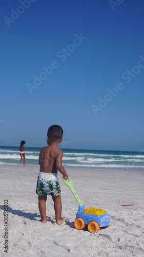 kid play in the beach 