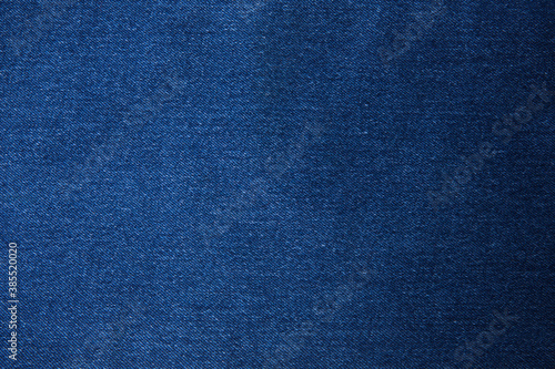 Texture of dark grated denim as background. Close-up