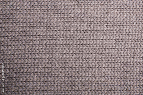 The texture of a knitted wool gray. Background