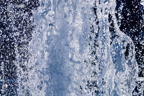 Blurred background of a strong jet of water.