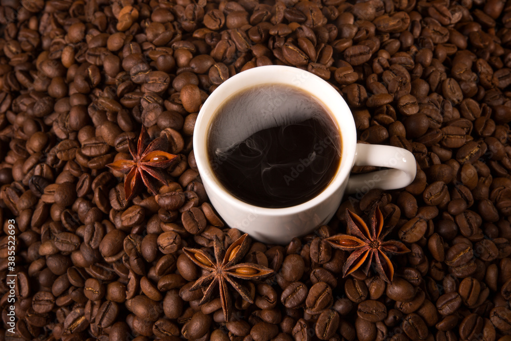 A cup of coffee on the background of coffee beans. A cup of coffee on the background of coffee beans.
