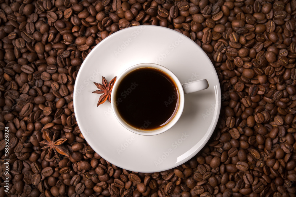 A cup of coffee on the background of coffee beans. A cup of coffee on the background of coffee beans.