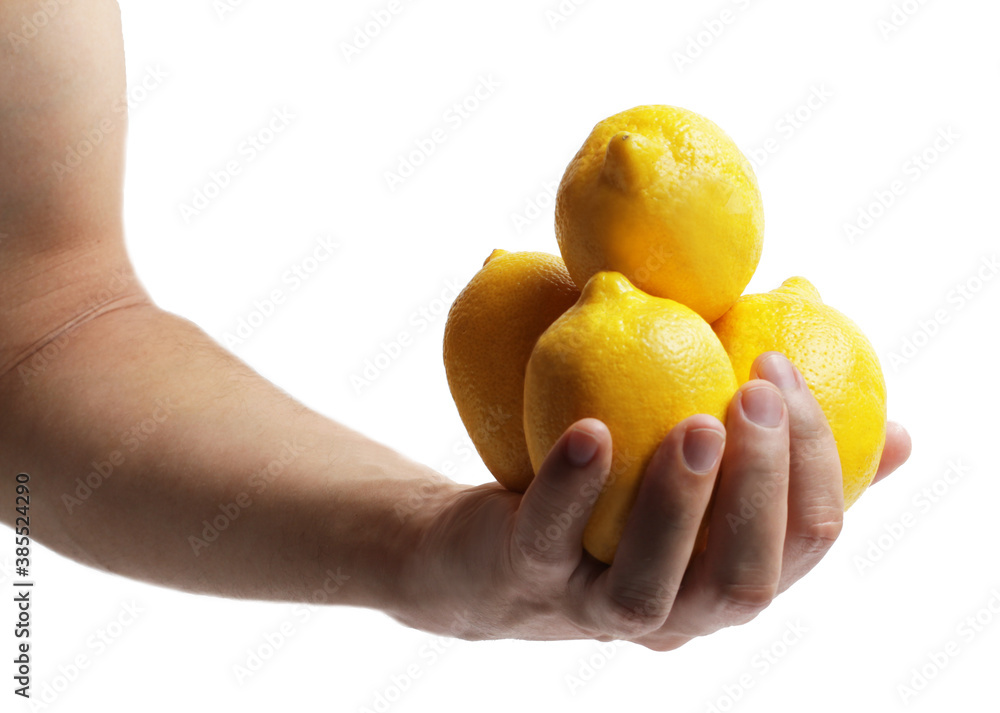 Lemons in the human hand. Isolated over white background. Concepts Lemons in the human hand. Isolated over white background. Concepts