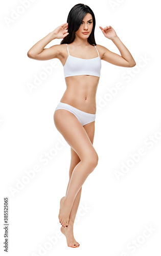 Fitness young woman with a beautiful body on white background