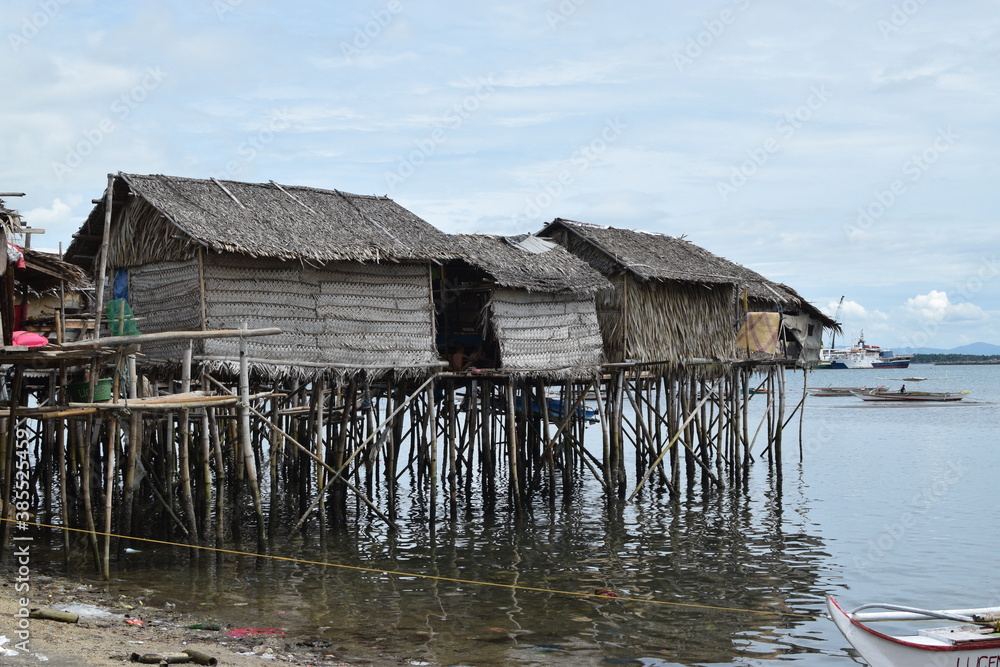 Bamboo poles support the stilt Bajau shanty houses built by indigenous