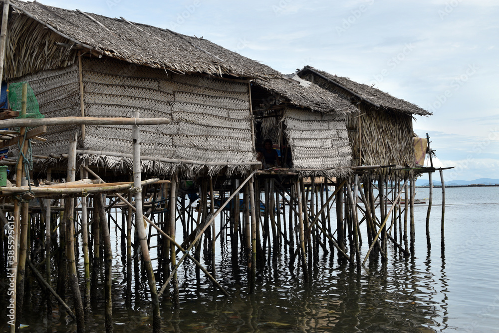 Bamboo poles support the stilt Bajau shanty houses built by indigenous