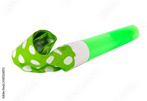 Fotografi Rolled green in dots festive noisemaker or party whistle horn on the white isola