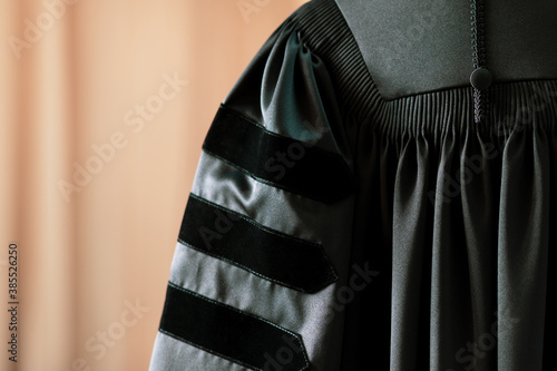 PhD graduate in black gown University degree