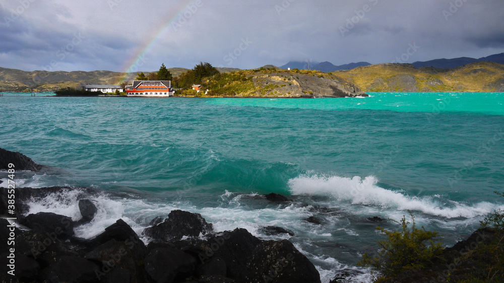 Waves on lake and stormy sky with rainbow. Nature scenery panorama, Patagonia, Chile